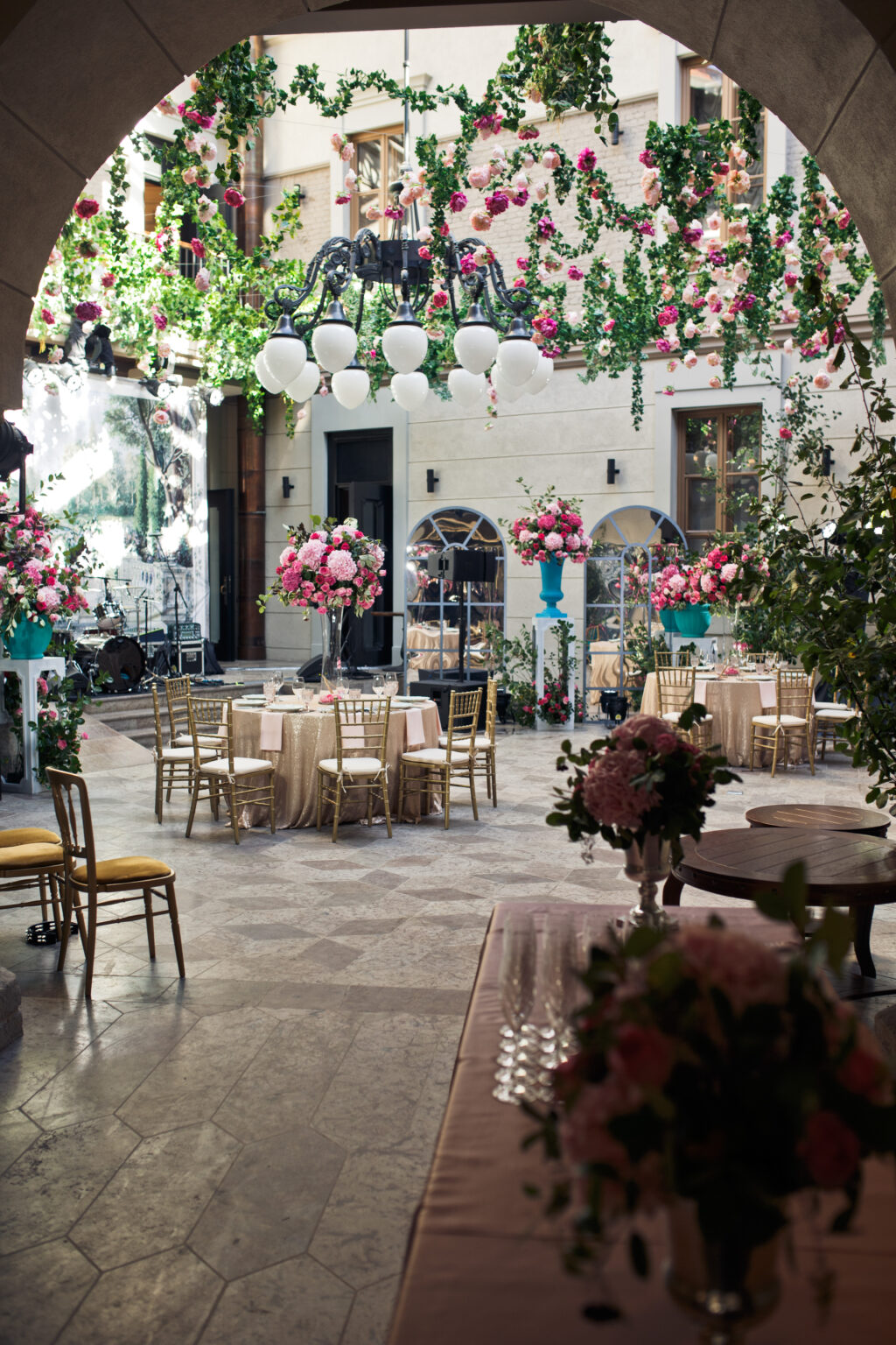 Look from afar at backyard decorated with flowers for wedding dinner